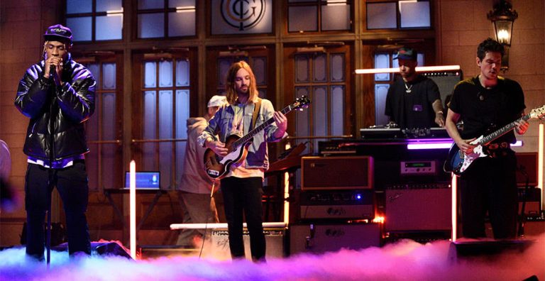 Travis Scott, Kevin Parker, and John Mayer performing on Saturday Night Live
