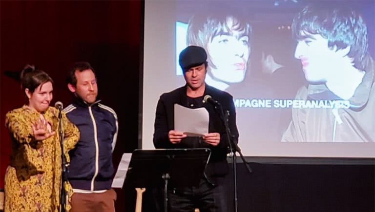 Brad Pitt helping Ben Lee and Lena Dunham kick off their 'Champagne Superanalysis' of the Gallagher brothers