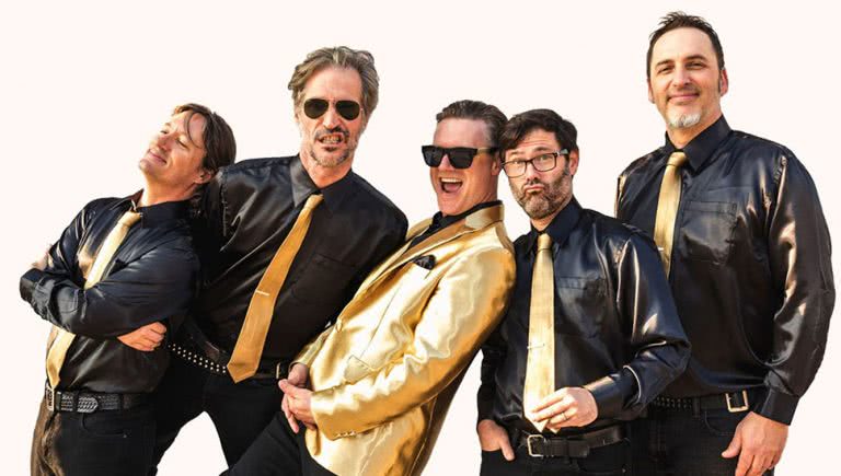 San Francisco punk rockers Me First And The Gimme Gimmes, with frontman Spike Slawson in the middle