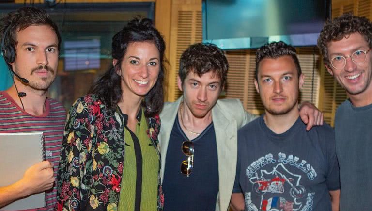 Image of triple j's Liam Stapleton posing as Veronica & Lewis' producer to meet the Arctic Monkeys