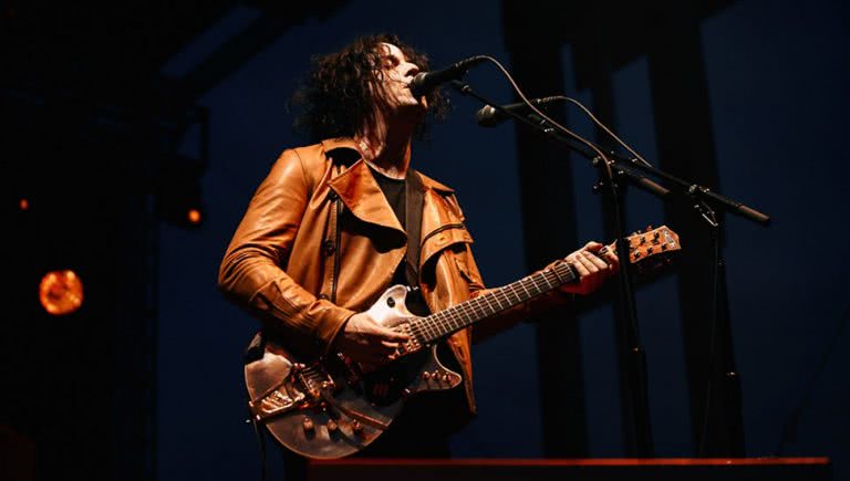 Jack White performing with The Raconteurs