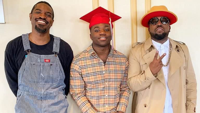 Outkast members André 3000 and Big Boi with the latter's son, Cross