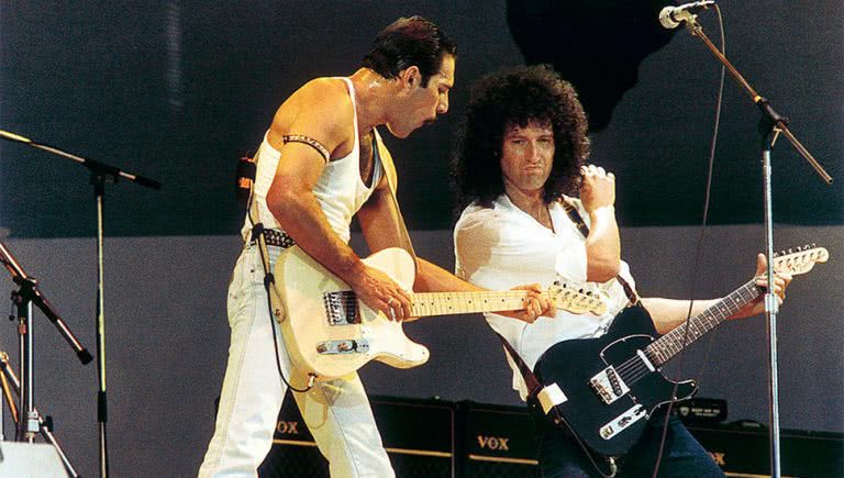 Freddie Mercury and Brian May of Queen performing at Live Aid in 1985