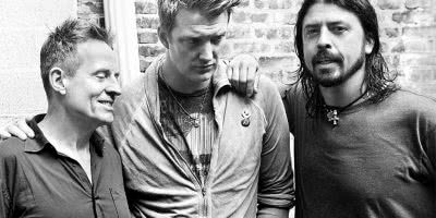 Image of John Paul Jones, Josh Homme, and Dave Grohl of Them Crooked Vultures