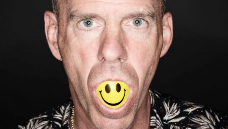 fatboy slim with smiley face in mouth