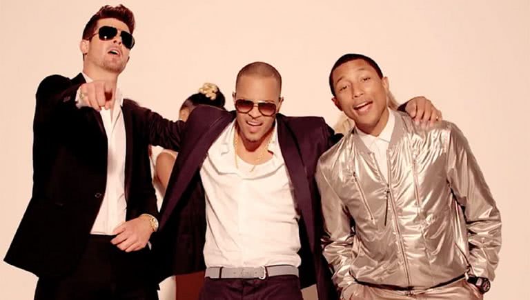 Image of Robin Thicke, T.I., and Pharrell Williams in the film clip for 'Blurred Lines'