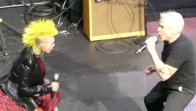 Image of Cyndi Lauper and Henry Rollins performing 'Rise Above'