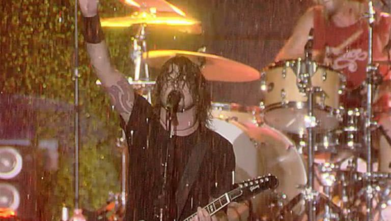 Dave Grohl performing in the rain at Lollapalooza
