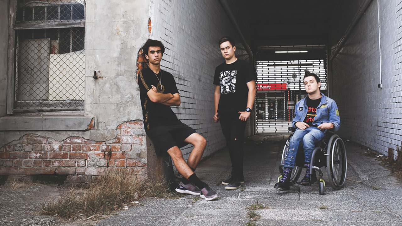New Zealand punk rockers Sit Down In Front sign with Native Tongue