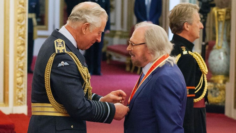 Barry Gibb knighted at Buckingham Palace